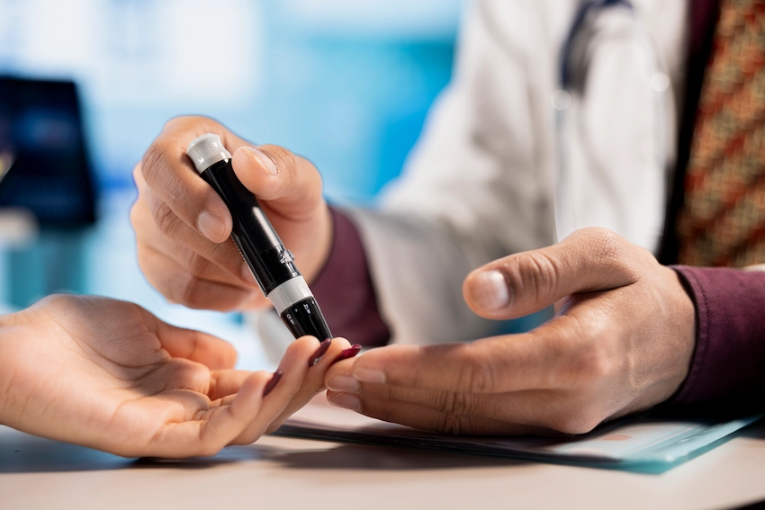 doctor checking patient blood sugar level