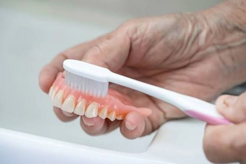 how to clean denture adhesive from your gums safely