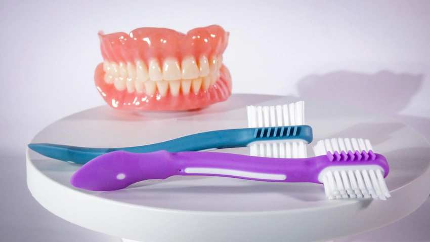 why do my dentures need to be dry for adhesive