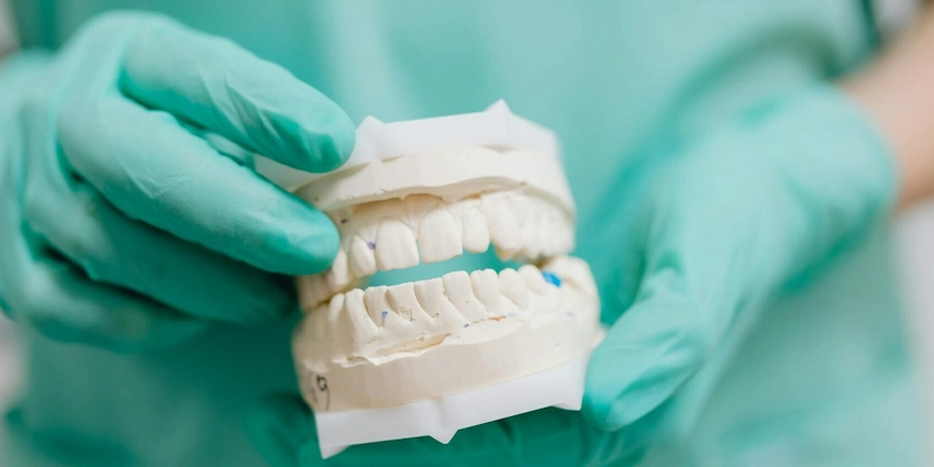 does denture adhesive cause nausea