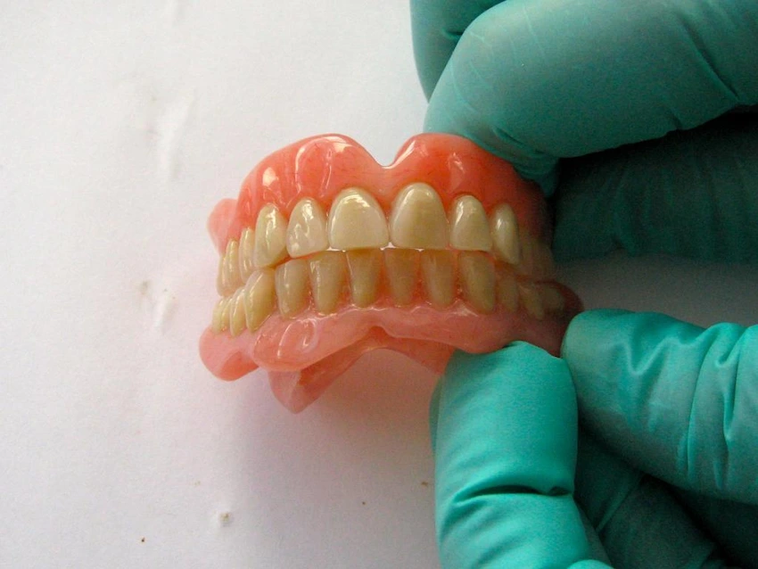 how to apply adhesive to upper dentures