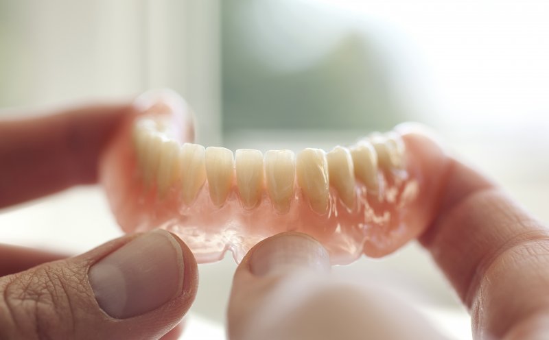 can i use denture adhesive on partials the clinical truth