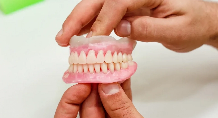 should you use adhesive on dentures at night
