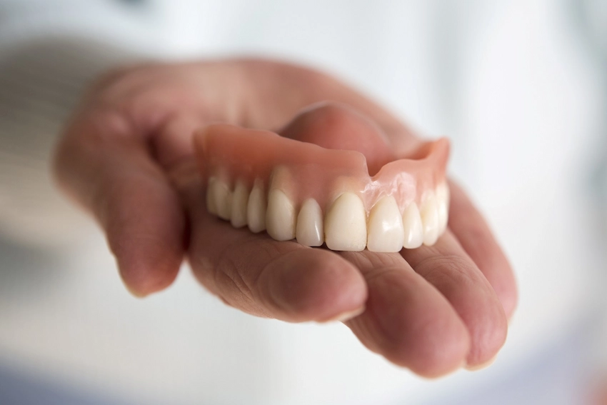 can you use denture adhesive for a temporary crown