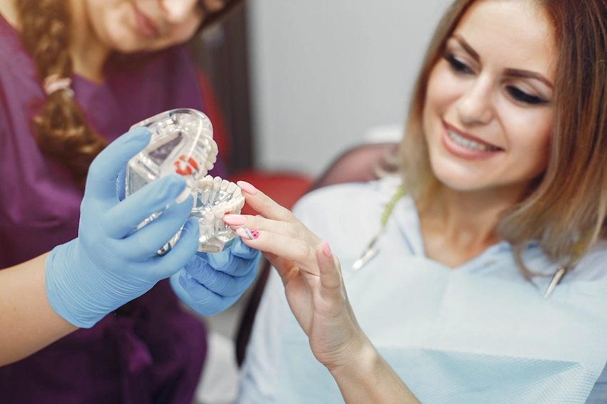 smiling female patient dentist examination