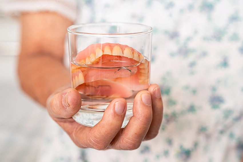 can denture adhesive cause stomach problems